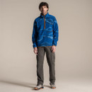 Full-length studio shot of a male model wearing the blue patterned half-zip fleece with walking trousers and hiking shoes.