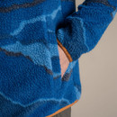 Close-up of the fleece side pocket with a hand inside, showing the thick fabric and contrast trim.