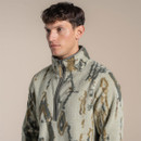 Close-up of the upper body showing the high collar, half-zip fastening and Craghoppers chest logo on the patterned fleece.