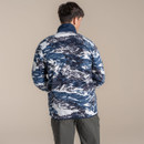 Rear view of a male model wearing the navy and white patterned fleece, highlighting the all-over print across the back and shoulders.