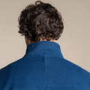 Close-up back-neck view showing the high collar and stitched branding on the blue fleece.