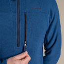 Detail close-up of the zipped chest pocket and half-zip fastening on the blue fleece.