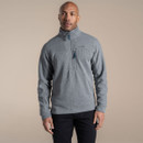 Model wearing grey half-zip fleece, front view, with stand collar and vertical zipped chest pocket.