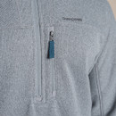 Close-up of grey half-zip fleece chest area, showing Craghoppers logo and vertical zipped chest pocket with blue zip pull.