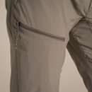 Close-up of the zipped thigh pocket with cord pull.