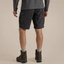 Back view of men’s dark grey Nosilife cargo shorts, worn with walking boots.