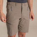Close-up of the shorts waistband with button fastening, belt loops, elasticated sides and zipped hand pockets.