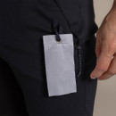 Close-up of the integrated “Glasses Wipe” tag attached inside the pocket on the black shorts.