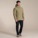 Full-length view of the model wearing the cardamom hooded insulated jacket with dark walking trousers and trainers.