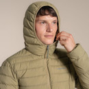 Close-up of the model wearing the jacket with the hood up and zip pulled up to the chin.