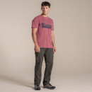 Side view of model wearing a red graphic T-shirt with short sleeves.