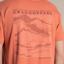 Close-up of the back print on the orange T-shirt with “CRAGHOPPERS” text and pattern graphic.