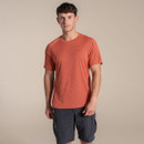 Model wearing dark salmon striped Craghoppers NosiLife SolarShield+ T-shirt with cargo shorts.