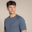 Close-up of blue-grey striped Craghoppers NosiLife SolarShield+ T-shirt showing chest logo and stitched raglan seams.