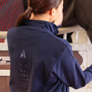 Close-up back view of navy sweatshirt showing the vertical Aubrion logo detail on the shoulder blade.