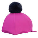 Bright pink equestrian helmet cover with black pom pom, angled rear view highlighting the fitted elastic edge.