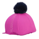 Bright pink riding hat silk with peak and black faux-fur pom pom, angled front view on a white background.