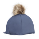 Slate blue Aubrion equestrian helmet cover with tan faux fur pom pom and elasticated hem, three-quarter rear view on a white background.