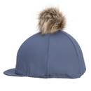 Slate blue Aubrion equestrian helmet cover with tan faux fur pom pom, side view showing the elasticated back on a white background.