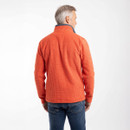 Back view of a model wearing a spice-orange gridfleece quarter-zip pullover with jeans.