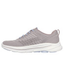 Grey athletic shoe with a knit texture, light blue laces, and a thick white sole. The design is sleek and modern, conveying comfort and style.
