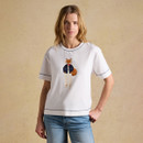 Model wearing a white short-sleeve T-shirt with a fox illustration on the front, styled with blue jeans.