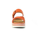 Front view of an orange platform sandal showing the cross straps and chunky striped sole.