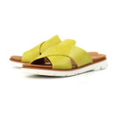 Pair of bright yellow crossover strap mule sandals on a white background, showing the tan footbed and chunky white sole.