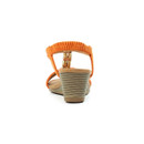 Rear view of orange wedge sandal showing the elasticated slingback strap and textured low wedge heel.