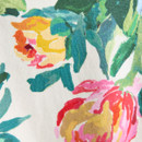 Close-up of the colourful floral print fabric, showing the painted flower and leaf design on the white material.
