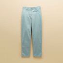 Flat lay of light blue chinos on a beige background, showing straight-leg shape and waistband button.