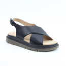 Black leather sandal with wide crossover straps, an adjustable back strap, and a cushioned platform sole on a white background.