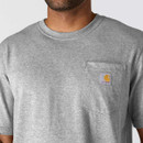 Close-up of the grey T-shirt neckline and chest pocket with Carhartt label.