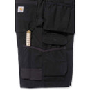 Close-up of black ripstop cargo shorts showing a buttoned cargo pocket and reinforced stitching.