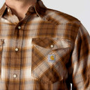 Close-up of Carhartt plaid shirt chest pocket with snap-fastening flap and logo patch.