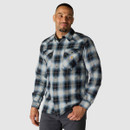 Man wearing the long-sleeve black, grey and light blue plaid snap-button shirt with chest pockets.