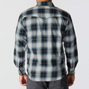 Back view of a men’s long-sleeve plaid shirt in black, grey and light blue checks.