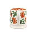 Rear view of half-pint ceramic mug with orange chrysanthemum flowers and green leaves, showing the handle.