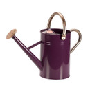 A tall glossy purple watering can with a rose sprinkler spout and copper-coloured handles, shown on a white background.