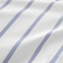 Macro close-up of blue stripes woven into white bedding fabric, highlighting texture and weave.