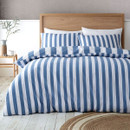 Blue and white vertical striped bedding set with matching pillowcases displayed on a neatly made bed.