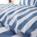 Detailed view of blue and white striped bedding fabric showing smooth texture and crisp vertical stripes.