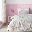 Children’s horse print duvet cover set in soft pastel colours, styled on a single bed in a pink bedroom with matching curtains.