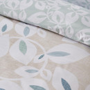 Detailed close-up of the leaf pattern duvet cover fabric, highlighting the soft colour palette and botanical design.