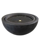 A round, dark stone water fountain bowl with gently rippling water. A soft light glows from the centre, creating a serene, tranquil ambiance.