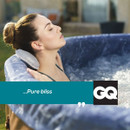 Woman leaning back with eyes closed in a Lay-Z-Spa Toronto hot tub, enjoying hydrotherapy.