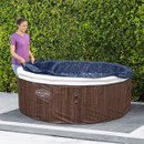 Lay-Z-Spa Toronto inflatable hot tub shown with insulated cover fitted in a garden setting.