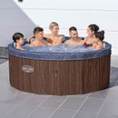 Group of adults enjoying the Lay-Z-Spa Toronto inflatable hot tub with padded headrests and bubbling AirJet massage system