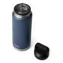 Angled top view of a navy YETI Rambler 36 oz bottle with the cap removed and placed beside it on a white background.