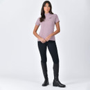 Full length front view of woman modelling a mauve WeatherBeeta short sleeve half zip riding top with black leggings and tall riding boots.